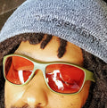 Face close-up of Da One Sunset Olive Green sunglasses worn